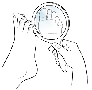 Hand holding mirror up to sole of foot.